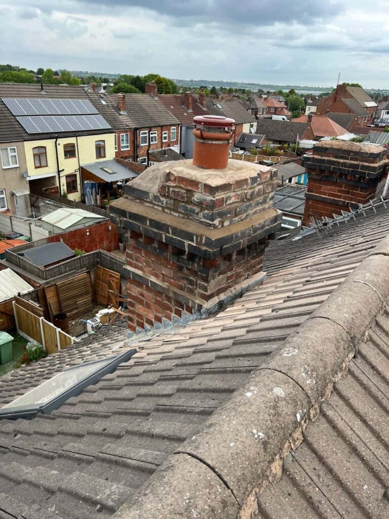 This is a photo taken from a roof which is being repaired by Burgess Hill Roofing Repairs, it shows a street of houses, and their roofs